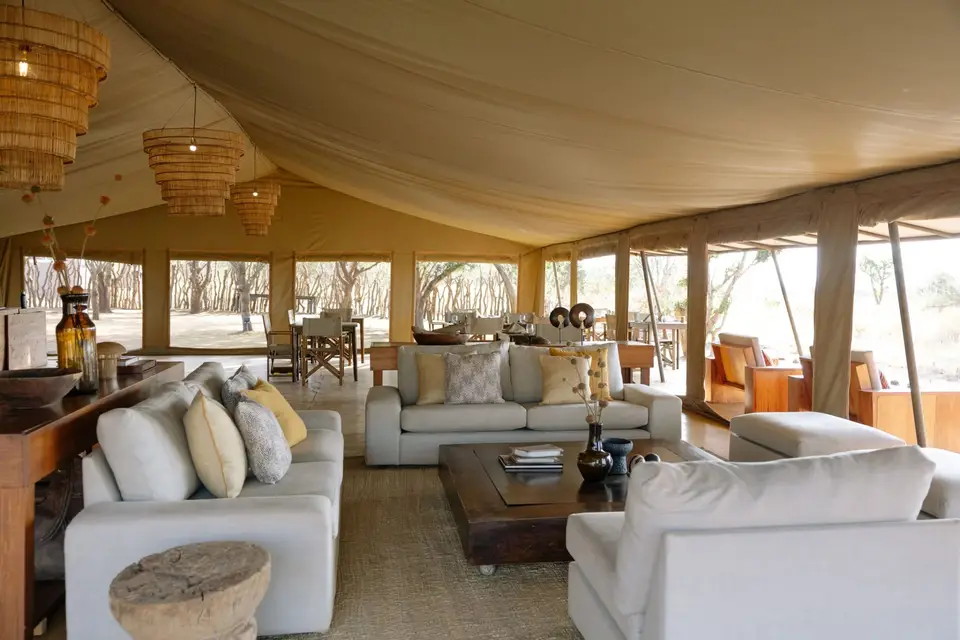 The Bush Camp lounge tent with sofas and open canvas sides