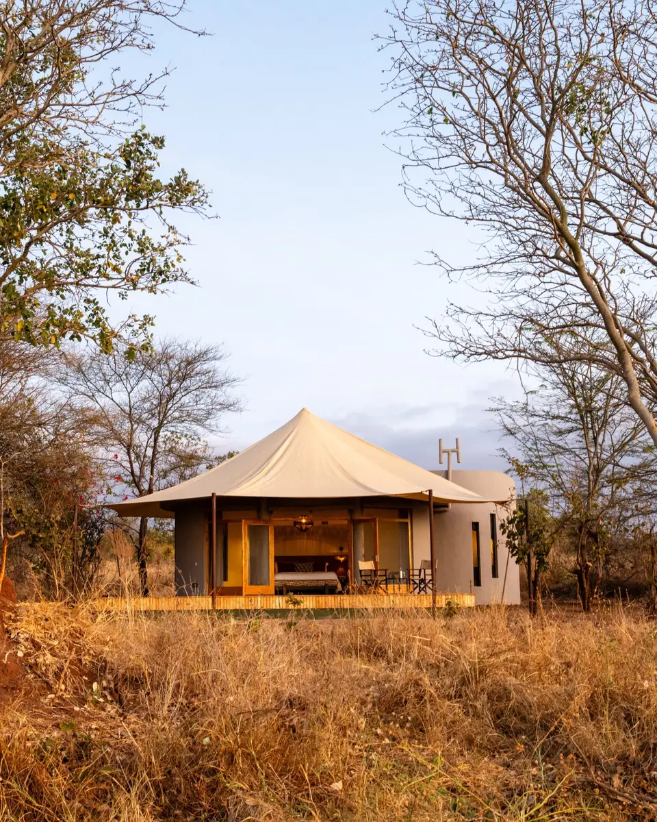 A round banda with a canvas roof and open doors onto its private terrace