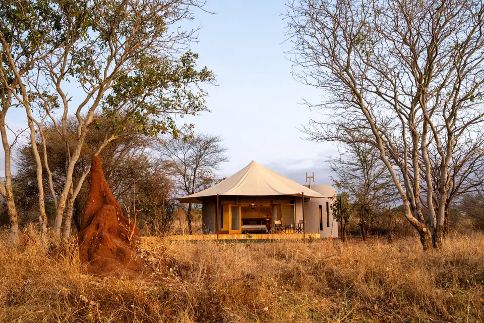A round banda with a canvas roof and open doors onto its private terrace